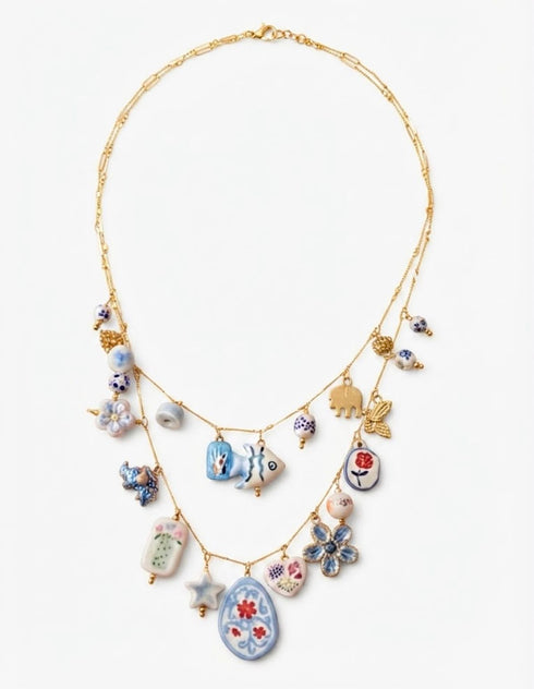 COLLANA CHARMS IN PORCELLANA BLU E ORO